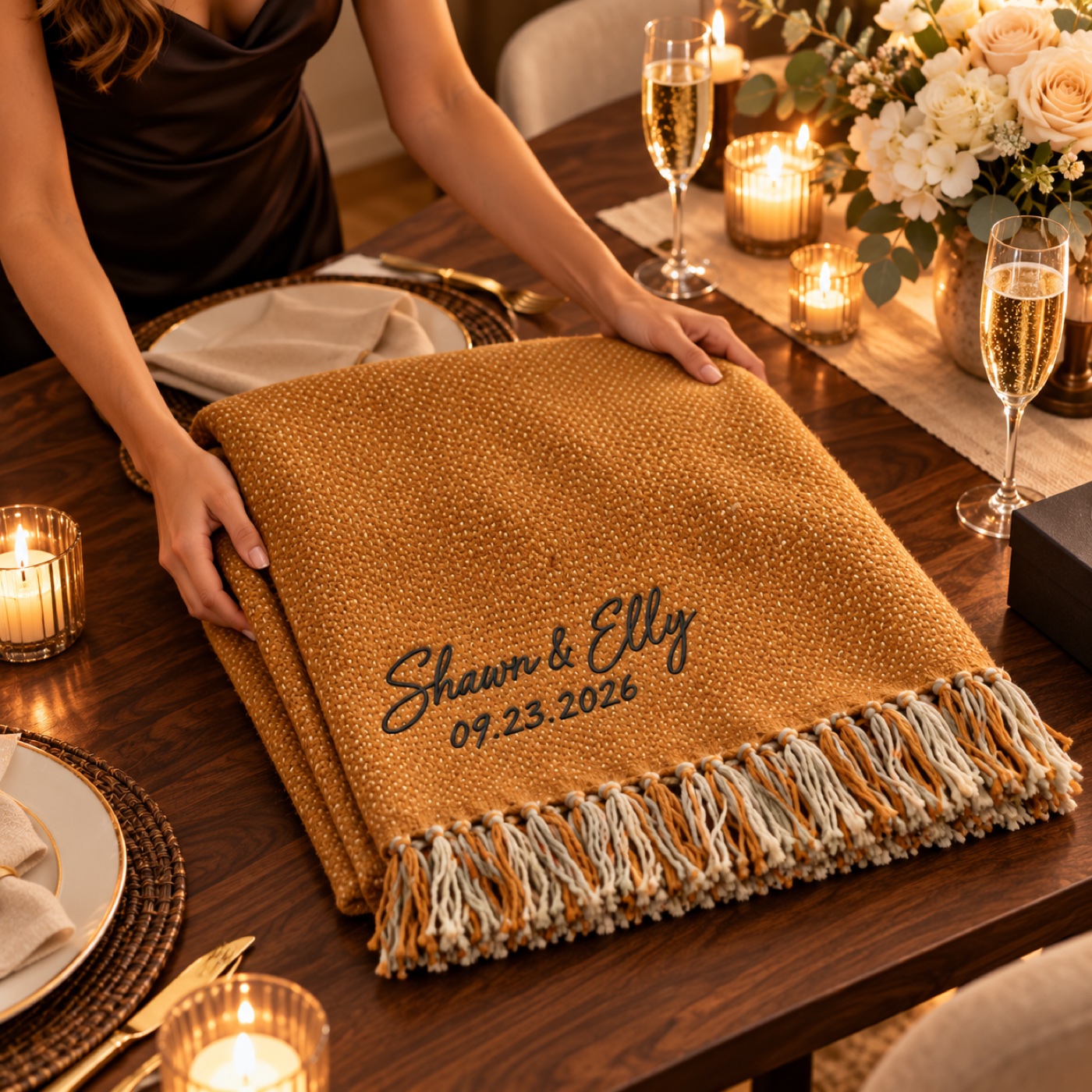 Golden amber personalized blanket on a candlelit anniversary dinner table